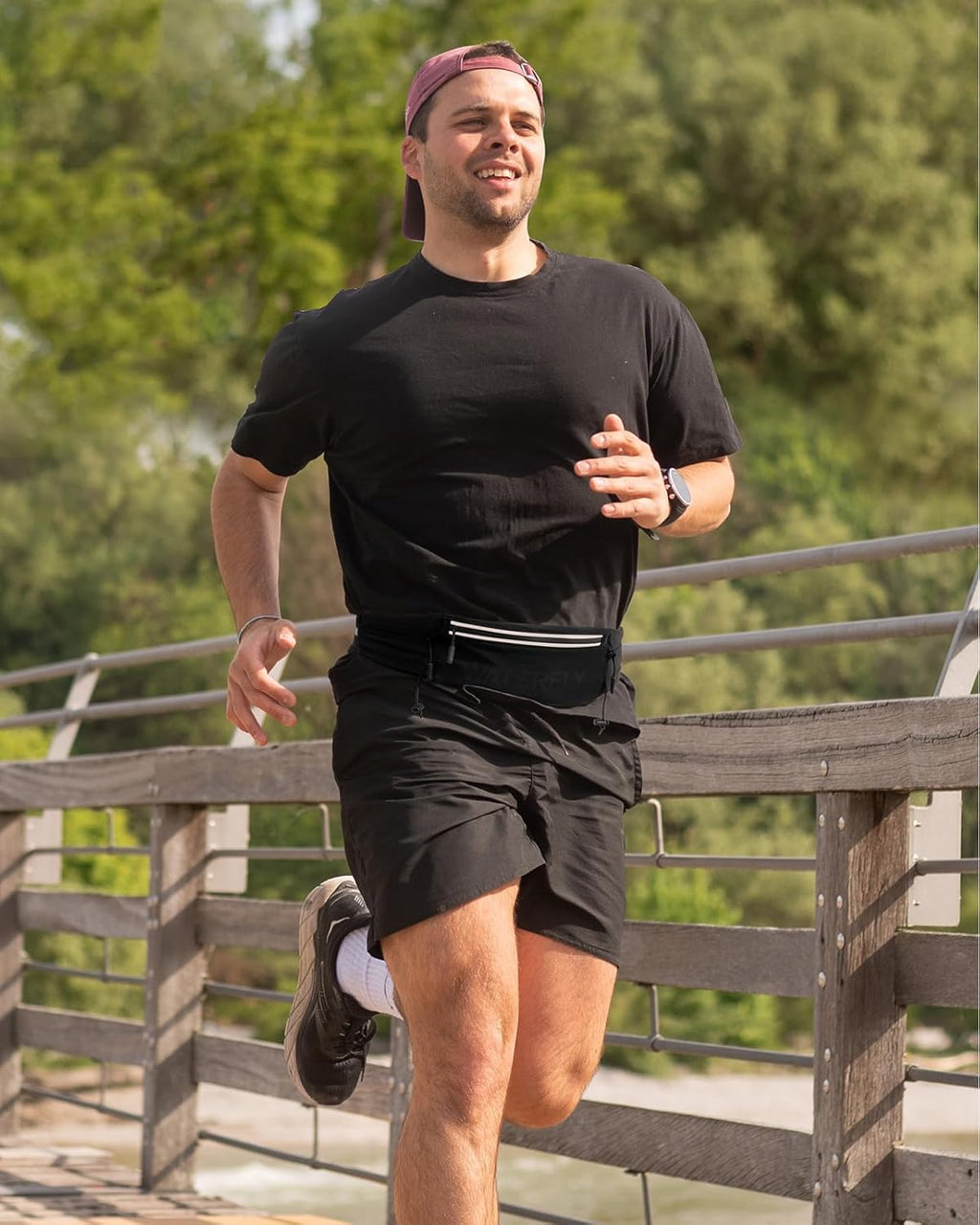 WATERFLY Running Belt - Breathable Fanny Pack with 3 Pockets for Fitness | Fits All Phones - Black