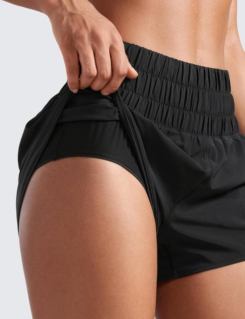 CRZ YOGA High Waisted Dolphin Running Shorts - Women's Athletic Gym Shorts with Zipper Pocket & Mesh Liner