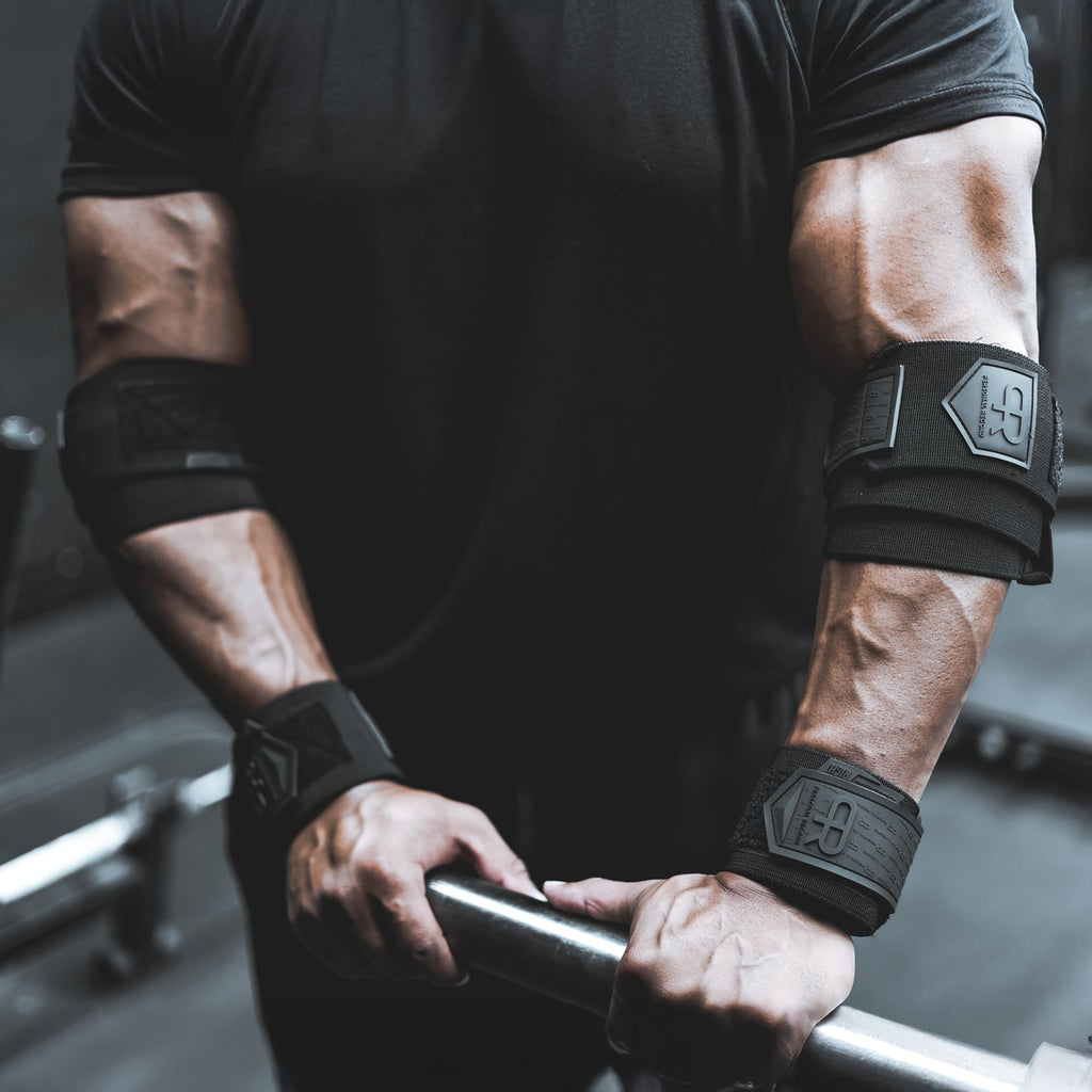 PR Personal Record Elbow Wraps for Weightlifting - Heavy Duty Construction, 25% More Elasticity, Reinforced Stitching, Extra Wide Fastener, Easy to Adjust, All Black